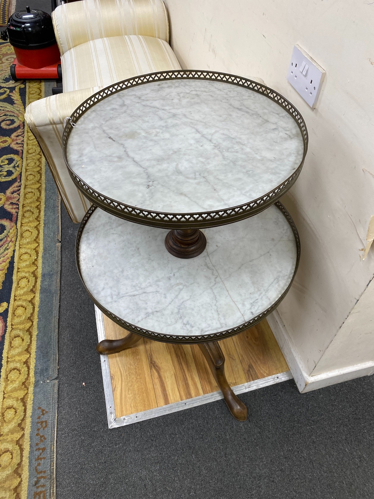 A reproduction mahogany and reconstituted marble two tier dumb waiter, height 92cm